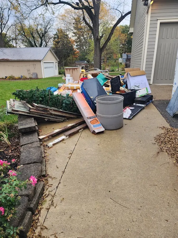 Dumpster being loaded with debris for Commercial Dumpster Rental in Norridgewock